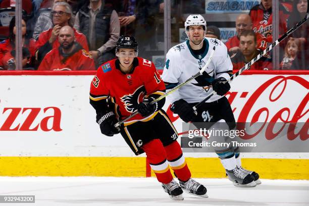 Johnny Gaudreau of the Calgary Flames skates against Marc Edouard-Vlasic of the San Jose Sharks during an NHL game on March 16, 2018 at the...