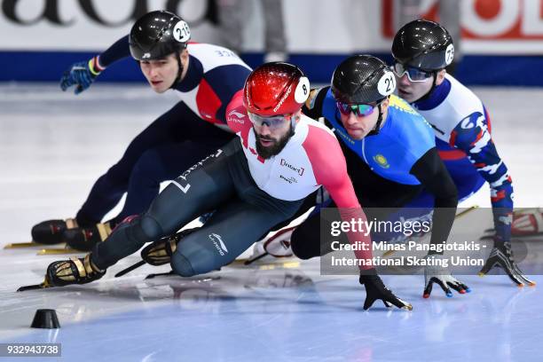 Charles Hamelin of Canada competes against Denis Nikisha of Kazakstan, Denis Ayrapetyan of Russia and Dmitry Migunov of France in the men's 1500...