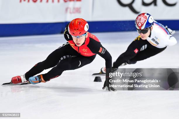 Tianyu Han of China competes against Yi Ra Seo of Korea in the men's 1500 meter heats during the World Short Track Speed Skating Championships at...