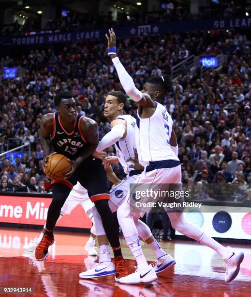 Pascal Siakam of the Toronto Raptors shoots the ball as Dwight Powell and Nerlens Noel of the Dallas Mavericks defends during the second half of an...