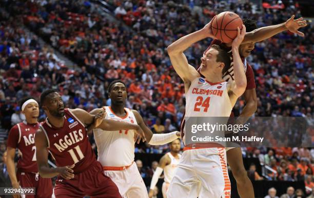 David Skara of the Clemson Tigers attempts to shoot against Johnathon Wilkins of the New Mexico State Aggies in the first half in the first round of...