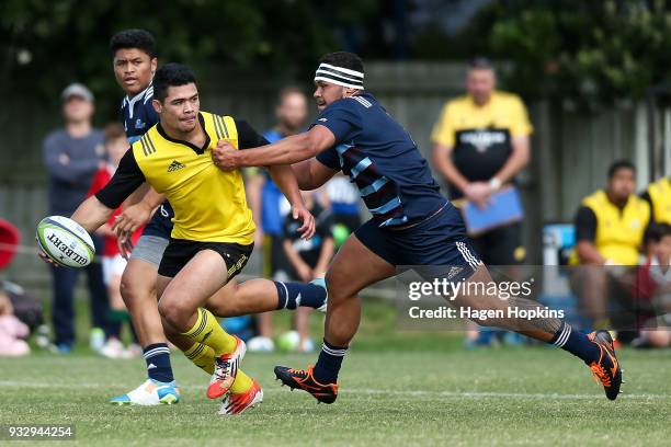 Du'Plessis Kirifi of the Hurricanes is tackled by Ezekiel Lindenmuth of the Blues A Team during the development squad trial match between the...