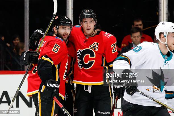 Mark Giordano and Sean Monahan of the Calgary Flames celebrates a goal against the San Jose Sharks during an NHL game on March 16, 2018 at the...