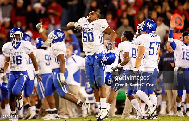 Sam Maxwell of the Kentucky Wildcats reacts after intercepting a pass by the Georgia Bulldogs in the final minutes at Sanford Stadium on November 21,...