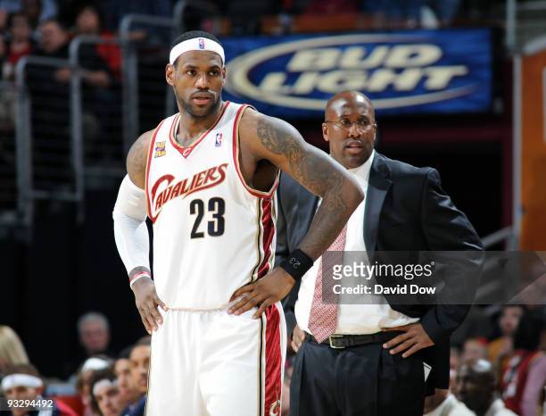 LeBron James & Head Coach Mike Brown of the Cleveland Cavaliers look down the court during game against the Philadelphia 76ers on November 21, 2009...