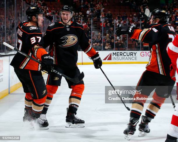Josh Manson, Nick Ritchie, and Ondrej Kase of the Anaheim Ducks celebrate Ritchie's first period goal during the game against the Detroit Red Wings...