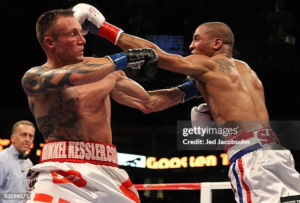 Mikkel Kessler of Denmark is hit by Andre Ward during their WBA Super Middleweight Championship Bout at the Oakland-Alameda County Coliseum on...