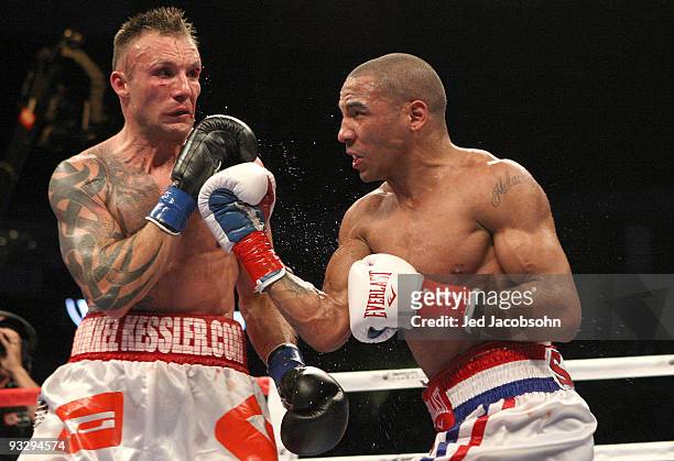 Mikkel Kessler of Denmark is hit by Andre Ward during their WBA Super Middleweight Championship Bout at the Oakland-Alameda County Coliseum on...