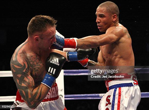 Mikkel Kessler of Denmark is hit by Andre Ward during their WBA Super Middleweight Championship Bout at the Oakland-Alameda County Coliseum on...