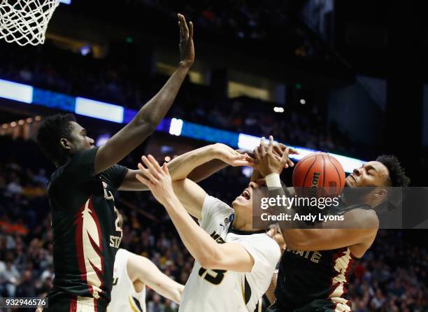 Michael Porter Jr. #13 of the Missouri Tigers fights for a rebound with Christ Koumadje and PJ Savoy of the Florida State Seminoles during the game...