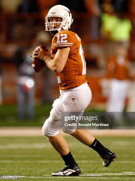 Quarterback Colt McCoy of the Texas Longhorns looks to pass against the Kansas Jayhawks at Darrell K Royal-Texas Memorial Stadium on November 21,...