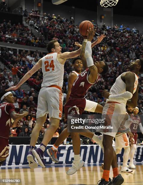 Harris of the New Mexico State Aggies shoots against David Skara of the Clemson Tigers in the first half in the first round of the 2018 NCAA Men's...