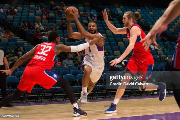 Aaron Harrison of the Reno Bighorns drives between defenders Skylar Spencer and Keith Steffeck of the Agua Caliente Clippers during an NBA G-League...