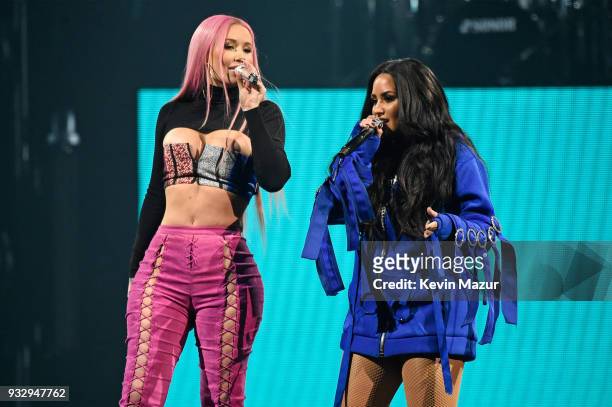 Demi Lovato and Iggy Azalea perform onstage during the "Tell Me You Love Me" World Tour at Barclays Center of Brooklyn on March 16, 2018 in New York...