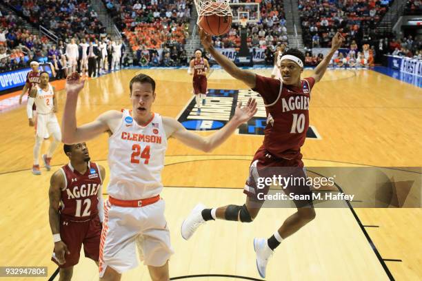 David Skara of the Clemson Tigers scores against Jemerrio Jones of the New Mexico State Aggies in the first half in the first round of the 2018 NCAA...