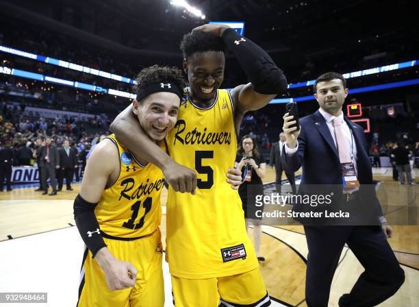 Maura and teammate Jourdan Grant of the UMBC Retrievers celebrate their 74-54 victory over the Virginia Cavaliers during the first round of the 2018...