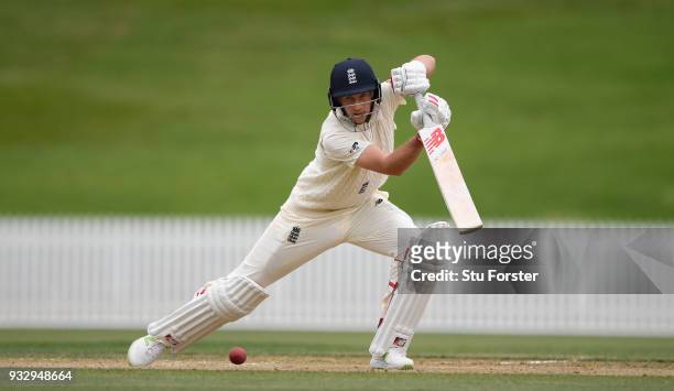 England batsman Joe Root hits out during day two of the Test warm up match between England and New Zealand Cricket XI at Seddon Park on March 17,...