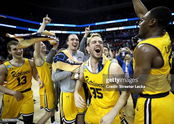 The UMBC Retrievers bench reacts to their 74-54 victory over the Virginia Cavaliers during the first round of the 2018 NCAA Men's Basketball...