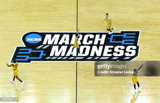 The UMBC Retrievers celebrate their 74-54 victory over the Virginia Cavaliers during the first round of the 2018 NCAA Men's Basketball Tournament at...