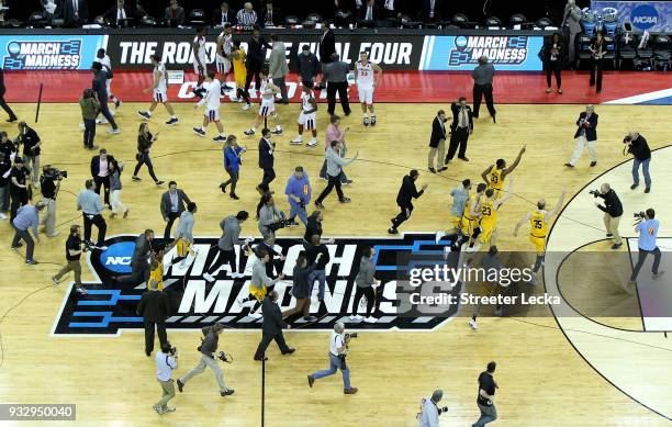 The UMBC Retrievers celebrate their 74-54 victory over the Virginia Cavaliers during the first round of the 2018 NCAA Men's Basketball Tournament at...