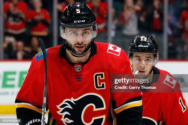 Mark Giordano and Johnny Gaudreau of the Calgary Flames celebrate a goal against the San Jose Sharks during an NHL game on March 16, 2018 at the...