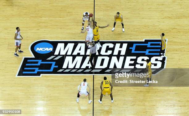 The Virginia Cavaliers tip off against the UMBC Retrievers in the first round of the 2018 NCAA Men's Basketball Tournament at Spectrum Center on...