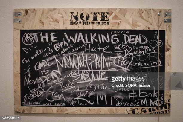 Note board seen at the exhibition. 54 artists are inspired by "The Walking Dead" and they present their own perspective in the post-apocalyptic and...