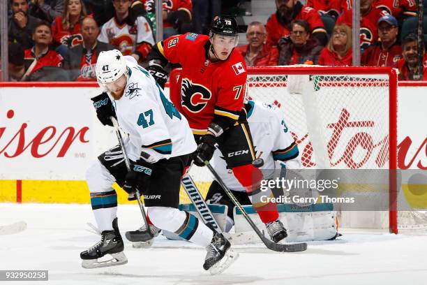 Micheal Ferland of the Calgary Flames skates against Joakim Ryan of the San Jose Sharks during an NHL game on March 16, 2018 at the Scotiabank...