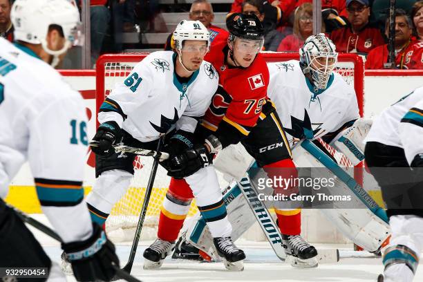 Micheal Ferland of the Calgary Flames skates against Justin Braun of the San Jose Sharks during an NHL game on March 16, 2018 at the Scotiabank...