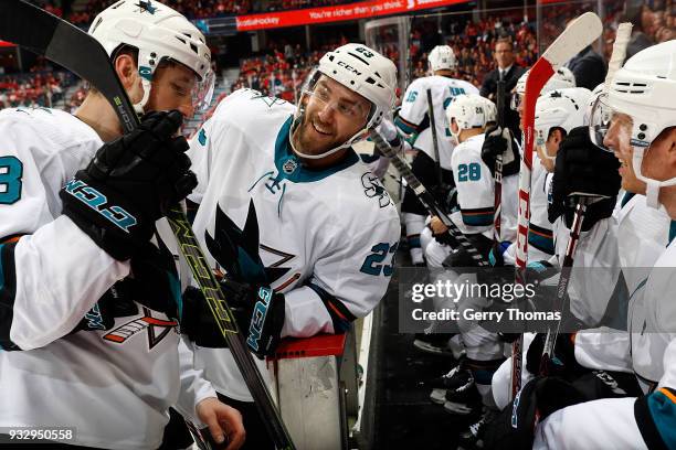 Barclay Goodrow and teammates of the San Jose Sharks have a discussion during an NHL game against the Calgary Flames on March 16, 2018 at the...