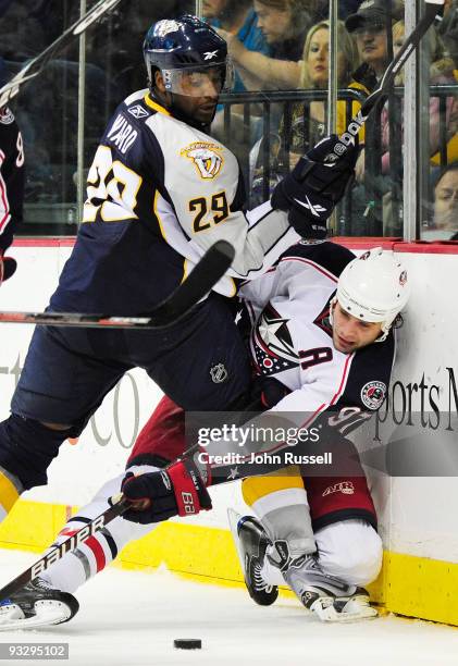 Joel Ward of the Nashville Predators battles Rostislav Klesla of the Columbus Blue Jackets on November 21, 2009 at the Sommet Center in Nashville,...