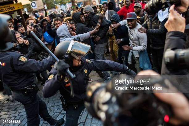 Riot police clash with demonstrators during a protest in support of Mmame Mbage, a Senegalese street vendor who died the day before of cardiac...