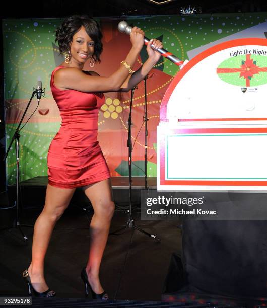 Actress Monique Coleman pulls the switch to light the 2009 UNICEF Snowflake Lighting on November 21, 2009 in Beverly Hills, California.