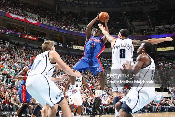 The Utah Jazz goes up to block Rodney Stuckey of the Detroit Pistons at EnergySolutions Arena on November 21, 2009 in Salt Lake City, Utah. NOTE TO...