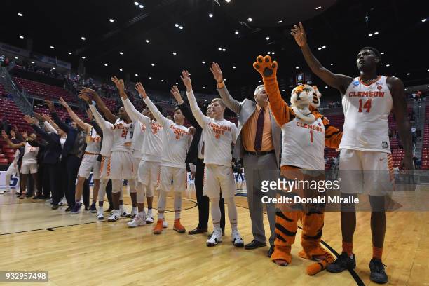 The Clemson Tigers celebrate their 79-68 win over the New Mexico State Aggies in the first round of the 2018 NCAA Men's Basketball Tournament at...