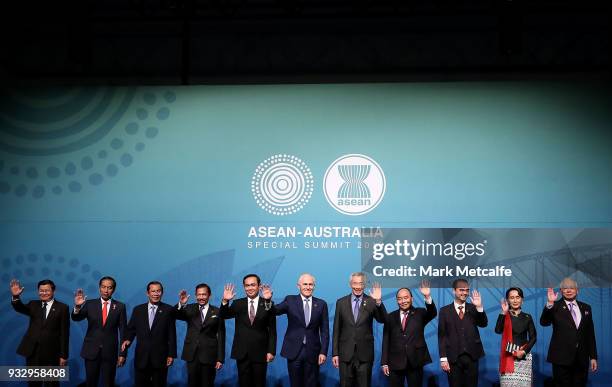 Australian Prime Minister Malcolm Turnbull poses for a formal welcome and family photo with , Laos' Prime Minister Thongloun Sisoulith, Indonesia's...