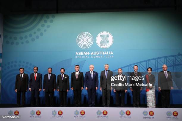 Australian Prime Minister Malcolm Turnbull poses for a formal welcome and family photo with , Laos' Prime Minister Thongloun Sisoulith, Indonesia's...