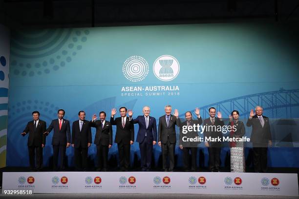 Australian Prime Minister Malcolm Turnbull poses for a formal welcome and family photo with , Laos' Prime Minister Thongloun Sisoulith, Indonesia's...