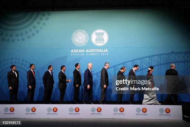 Australian Prime Minister Malcolm Turnbull poses for a formal welcome and family photo with , Laos' Prime Minister Thongloun Sisoulith, Indonesia's...