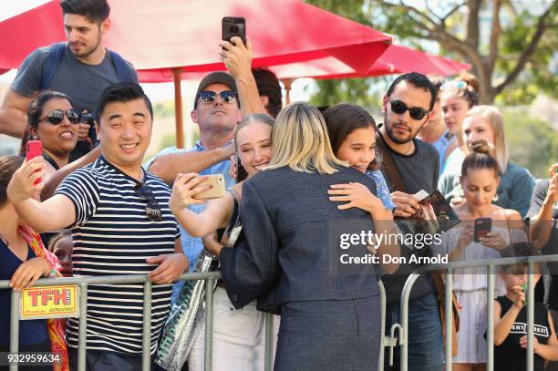 Margot Robbie greets a fan taking a selfie during the Peter Rabbit Australian Premiere on March 17, 2018 in Sydney, Australia.