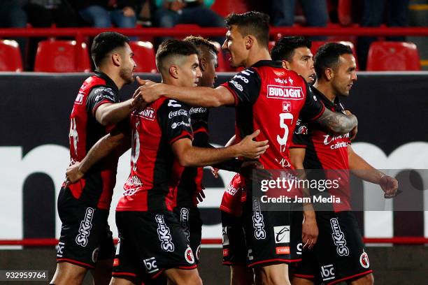 Players of Tijuana celebrate their first goal scored by Miller Bolanos during the 12th round match between Tijuana and Morelia as part of the Torneo...