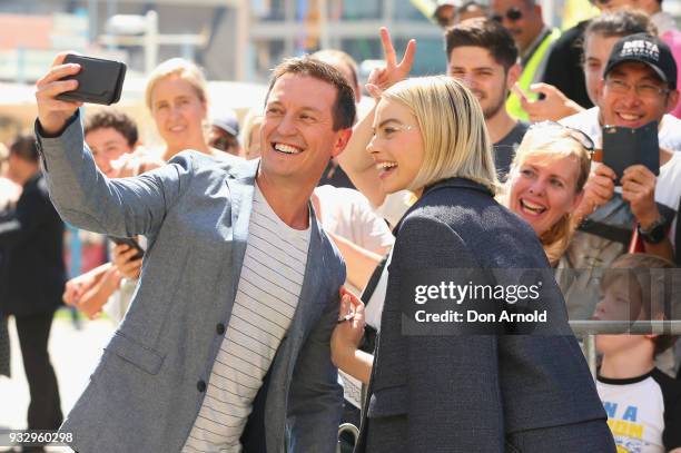 Rove McManus takes a selfie with Margot Robbie during the Peter Rabbit Australian Premiere on March 17, 2018 in Sydney, Australia.