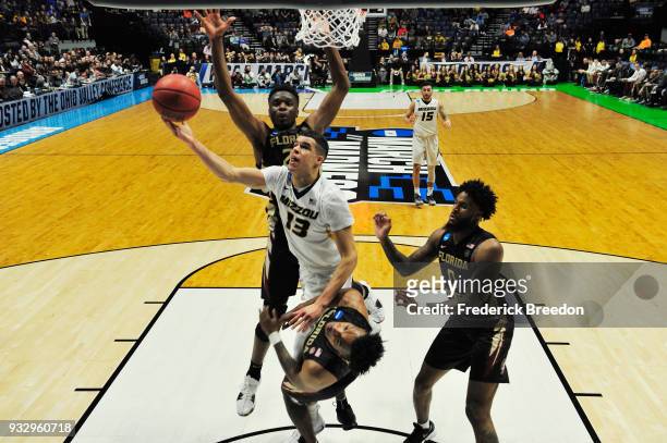 Michael Porter Jr. #13 of the Missouri Tigers puts up a layup against the Florida State Seminoles during the game in the first round of the 2018 NCAA...