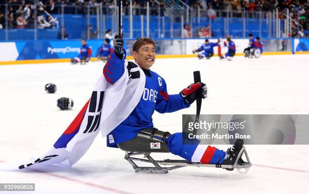 Su Min Han of Korea celebrates after winning the bronze medal over Italy in the Ice Hockey bronze medal game between Korea and Italy during day eight...