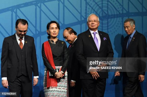 Singapore's Prime Minister Lee Hsien Loong and Vietnam's Prime Minister Nguyen Xuan Phuc make their way for a family picture as Malaysia Prime...