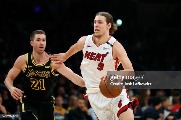 Kelly Olynyk of the Miami Heat drives to the basket against Travis Wear of the Los Angeles Lakers during the game at Staples Center on March 16, 2018...