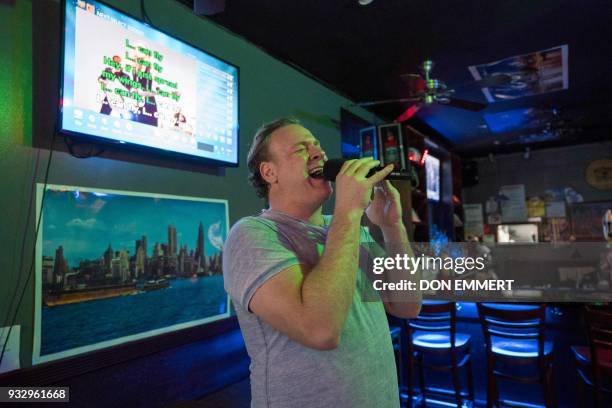 Operatic baritone Lucas Meachem, who is performing in "La Boheme" at the Met, sings at a karaoke bar on March 8, 2018 in New York. His voice packing...