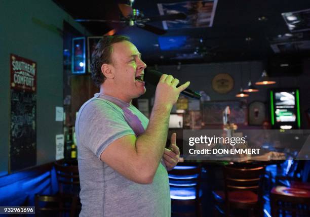 Operatic baritone Lucas Meachem, who is performing in "La Boheme" at the Met, sings at a karaoke bar on March 8, 2018 in New York. His voice packing...