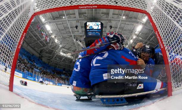 Jon Ho Jang of Korea celebrate with his team mates after winning the bronze medal over Italy in the Ice Hockey bronze medal game between Korea and...