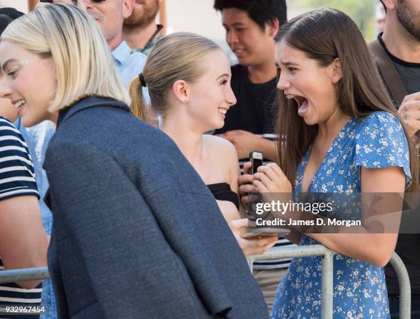 Two young female fans react after meeting actress Margot Robbie as she attends the Peter Rabbit Australian Premiere on March 17, 2018 in Sydney,...